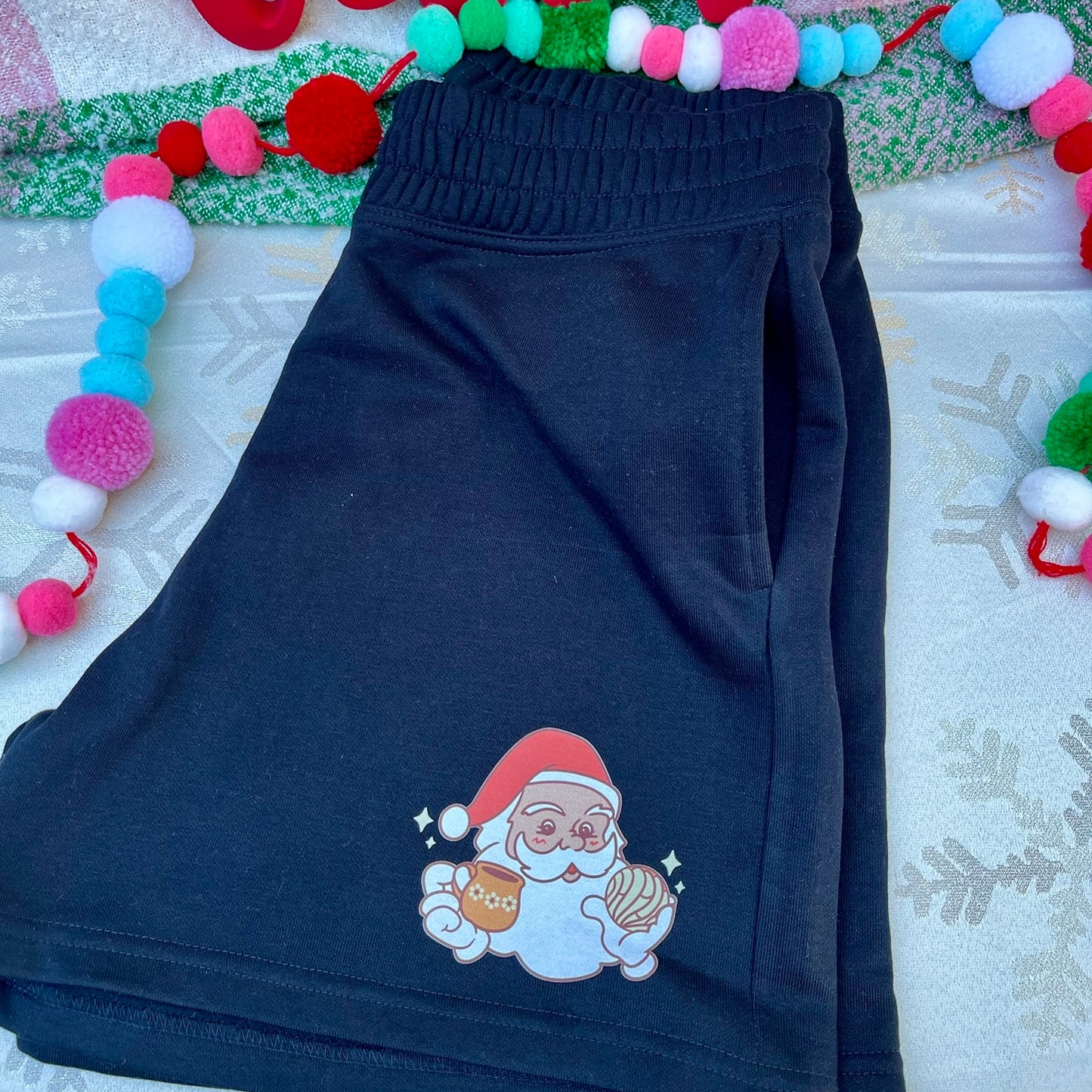 Women’s Black Jogger High-rise Shorts with a Santa holding a Concha