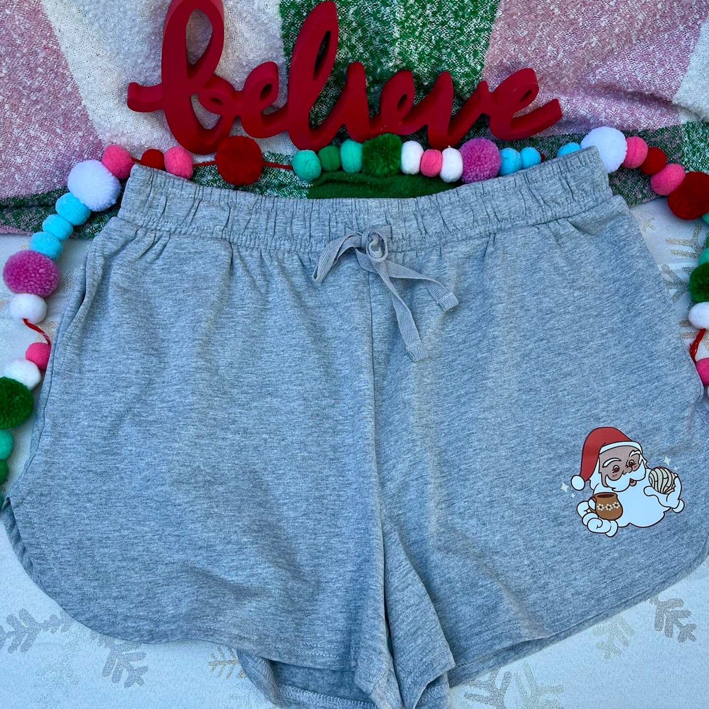 Women’s Gray Jogger Shorts with a Santa holding a concha